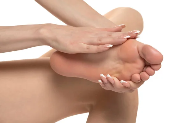 Woman Massaging Her Painful Foot White Studio Background —  Fotos de Stock