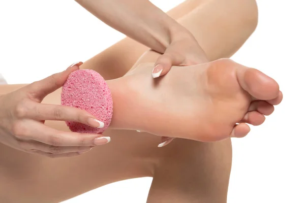 Woman Pampring Her Foot Sponge White Studio Background — Fotografia de Stock