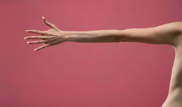 Young Woman Stretched Arm Palm Isolated Pink Background — Zdjęcie stockowe