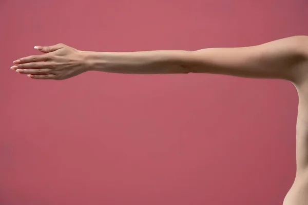 Young Woman Stretched Arm Palm Isolated Pink Background — Stockfoto