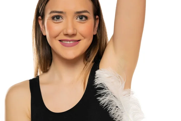 Young Smiling Woman Caressing Armpit White Feather White Background — Fotografia de Stock