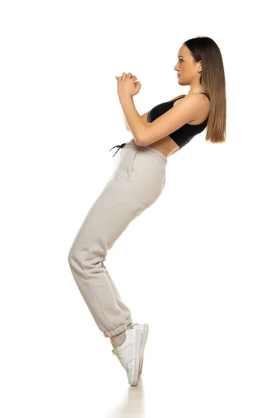 Young Woman Gray Tracksuit Black Top Poses White Background Studio —  Fotos de Stock