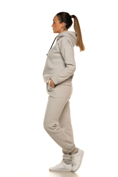 Young Woman Gray Tracksuit Pony Tail Posing White Background Studio — Photo