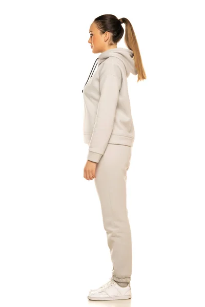 Young Woman Gray Tracksuit Pony Tail Posing White Background Studio — Stockfoto