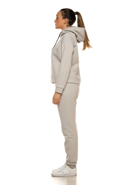 Young Woman Gray Tracksuit Pony Tail Posing White Background Studio — Foto de Stock