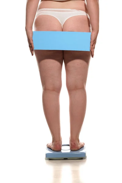 Back View Obese Woman Standing Scale Holding Empty Board Her — Foto Stock