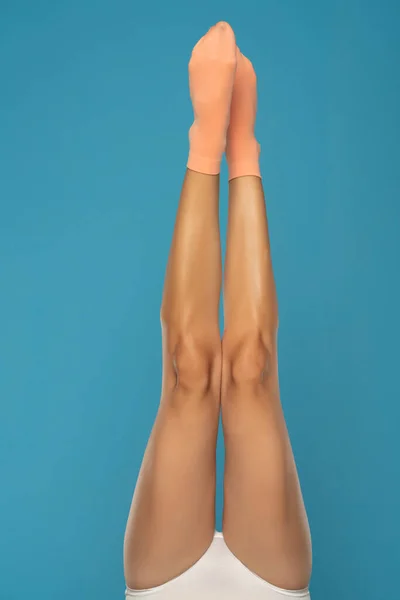 Pretty Female Legs Orange Short Socks Blue Background — Φωτογραφία Αρχείου