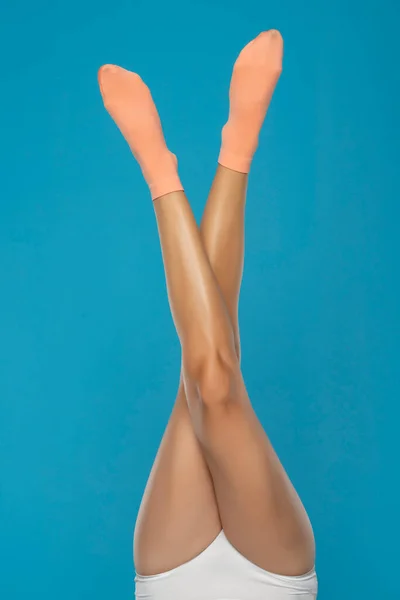 Pretty Female Legs Orange Short Socks Blue Background — Φωτογραφία Αρχείου