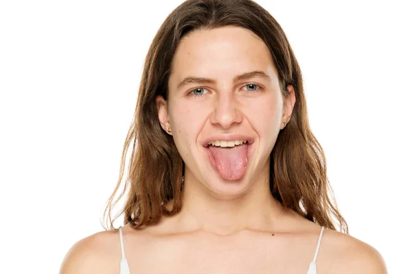 Young Woman Sticking Tongue Out White Background — 스톡 사진