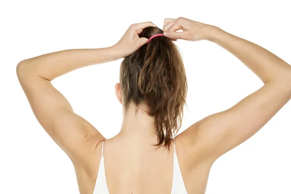 Rear View Young Woman Tying Her Long Wavy Hair White — Foto Stock