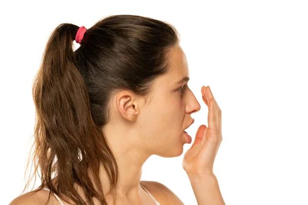 Profile Young Woman Checks Her Breath Her Palm White Background — Zdjęcie stockowe