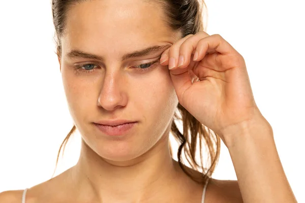 Young Woman Rubbing Eye White Background Annoying Itch — Stock Photo, Image