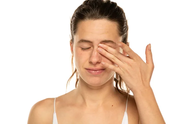 Young Woman Rubbing Eye White Background Annoying Itch — Stock Photo, Image
