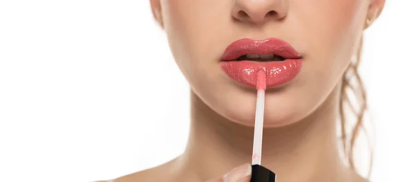 Close Beautiful Young Woman Applying Lipgloss White Background — Stok Foto