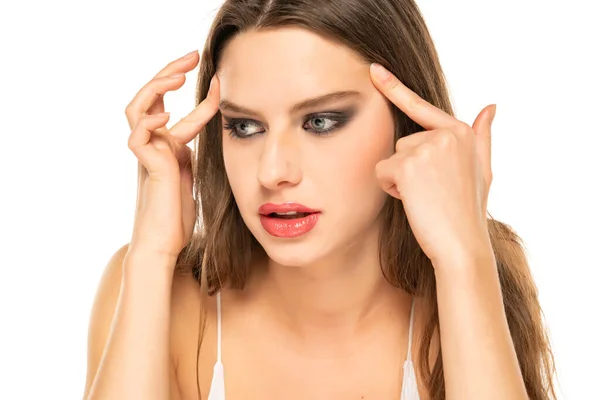 Young Woman Tightens Her Eyes Eyebrows Mirror White Background — Photo