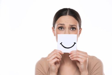 Unhappy young woman with smile, drawn on sheet of paper on a white studio background.