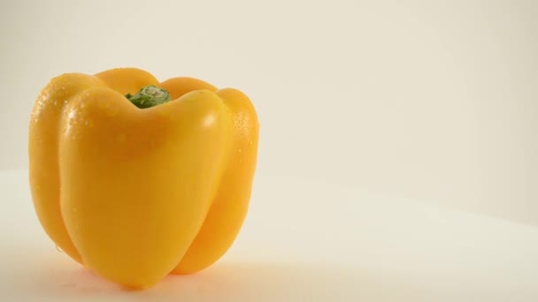 Rotating Yellow Pepper Against White - Crane Down — Stock Video