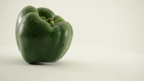 Rotating Green Pepper Against White - Crane Up — Stock Video