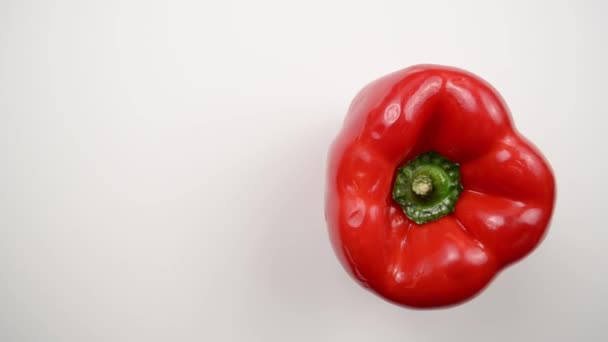 Rotating Red Pepper Against White - Overhead Dolly Right — Stock Video