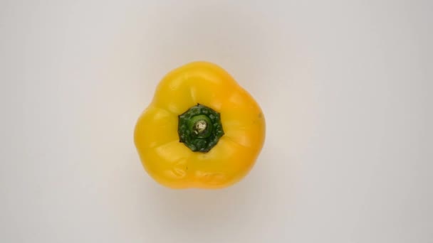 Yellow Pepper Against White - Overhead Dolly Right — Stock Video