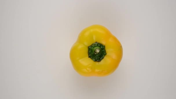 Yellow Pepper Against White - Overhead Dolly Left — Stock Video