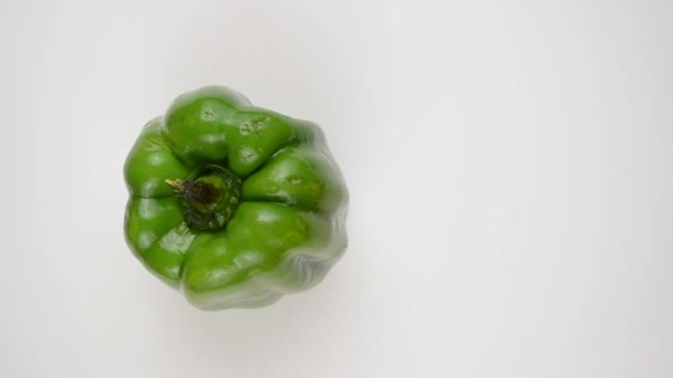 Rotating Green Pepper Against White - Overhead Dolly Left — Stock Video