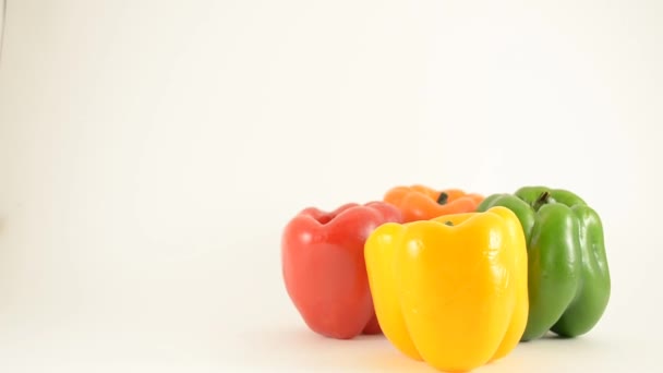 Yellow, Red, Green and Orange Peppers Against White - Diamond Arrangement - Crane Down — Stock Video