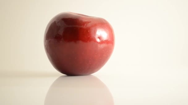 Rotating Rome Apple On Acrylic Against White - Dolly Left — Stock Video