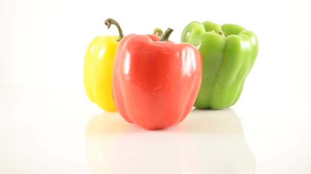 Red, Green, Orange and Yellow Peppers On Acrylic Against White - Diamond Arrangement - Dolly Right — Stock Video