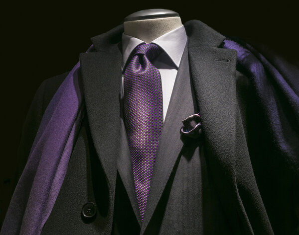 Black coat, black jacket, purple tie & scarf