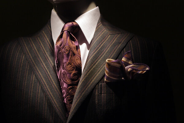 Dark brown striped jacket, purple tie and handkerchief