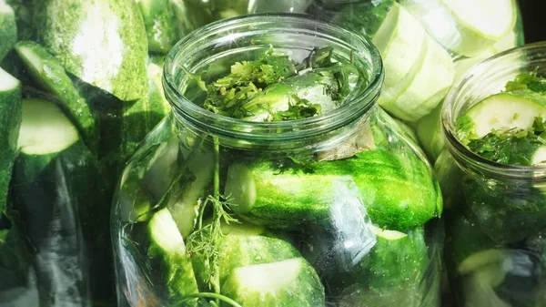 cucumber salad in jar, cucumbers, dill and greens.Canned cucumber jar, open lid