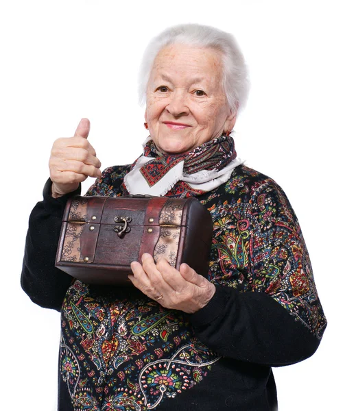 Smiling old woman with casket — Stock Photo, Image