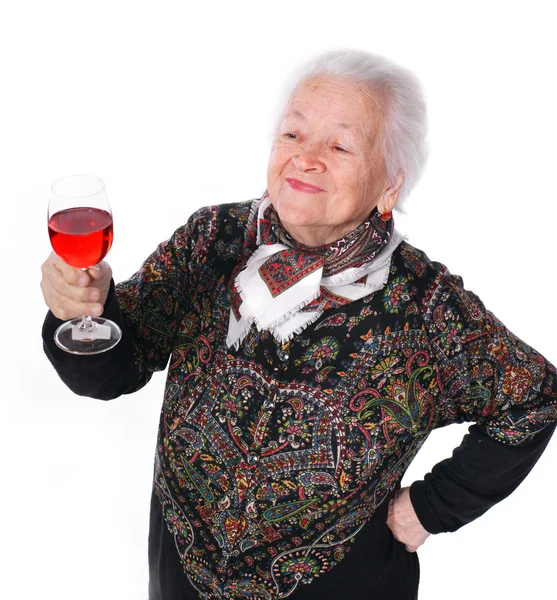 Jolie vieille femme avec un verre de vin — Photo