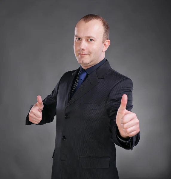 Businessman gesturing thumbs up with both hands — Stock Photo, Image