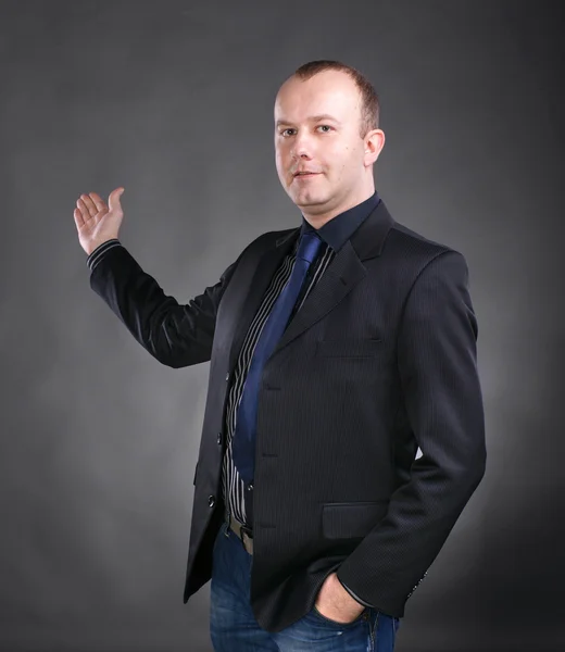 Business man in suit giving presentation — Stock Photo, Image