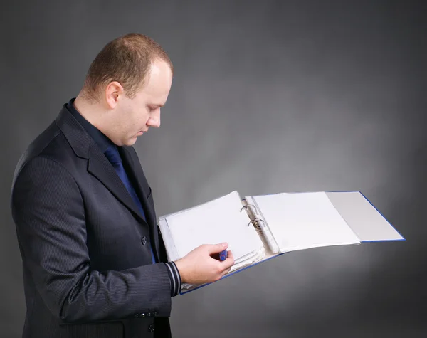 Young businessman with folders — Stock Photo, Image