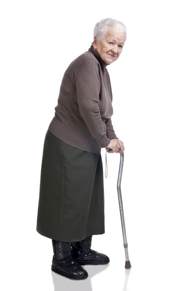 Stará žena s holí — Stock fotografie