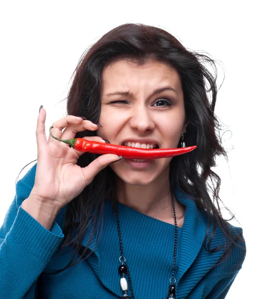 Young girl tasting chili pepper — Stock Photo, Image