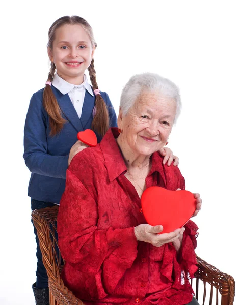 Granddaughter and grandmother with hearts — Stock Photo, Image