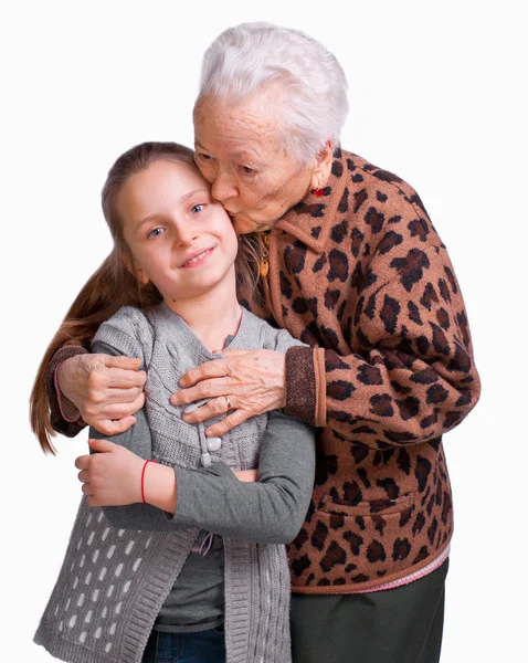 Grandmother kissing her granddaughter — Stock Photo, Image