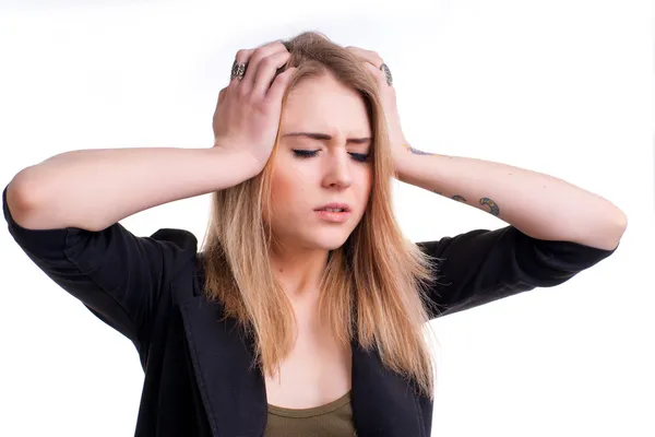 Young girl suffering from headache on a white background — Stock Photo, Image