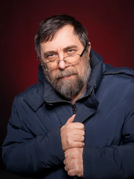 Portrait of elderly man in glasses — Stock Photo, Image