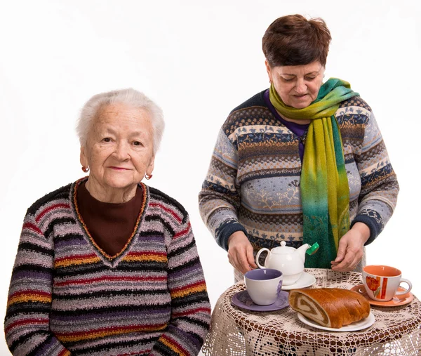 Mother having tea with her daughter — Stock Photo, Image