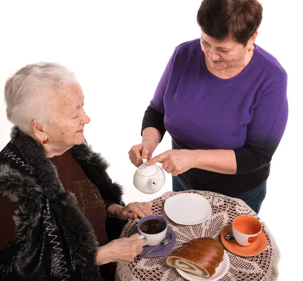 Mother having tea with her daughter — Stock Photo, Image