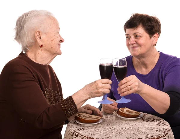 Happy mother with daughter drinking wine — Stock Photo, Image