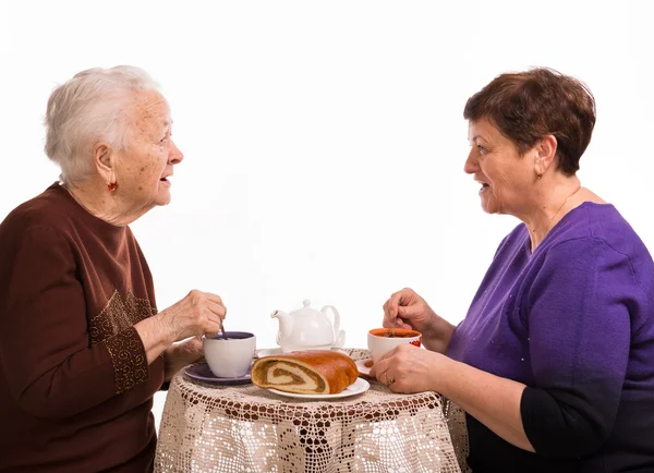 Mother having tea with her daughter Stock Image