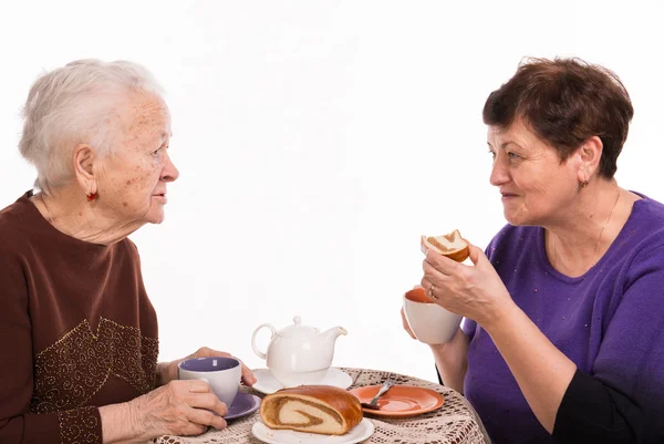 Mother having tea with her daughter Stock Photo