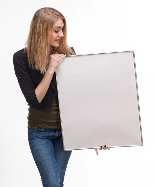 Portrait of a young blond holding empty billboard — Stock Photo, Image