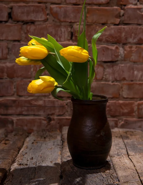 Beautiful yellow tulips in vase — Stock Photo, Image